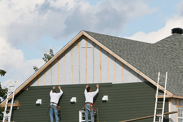 Professional Siding technician working in Munson, PA